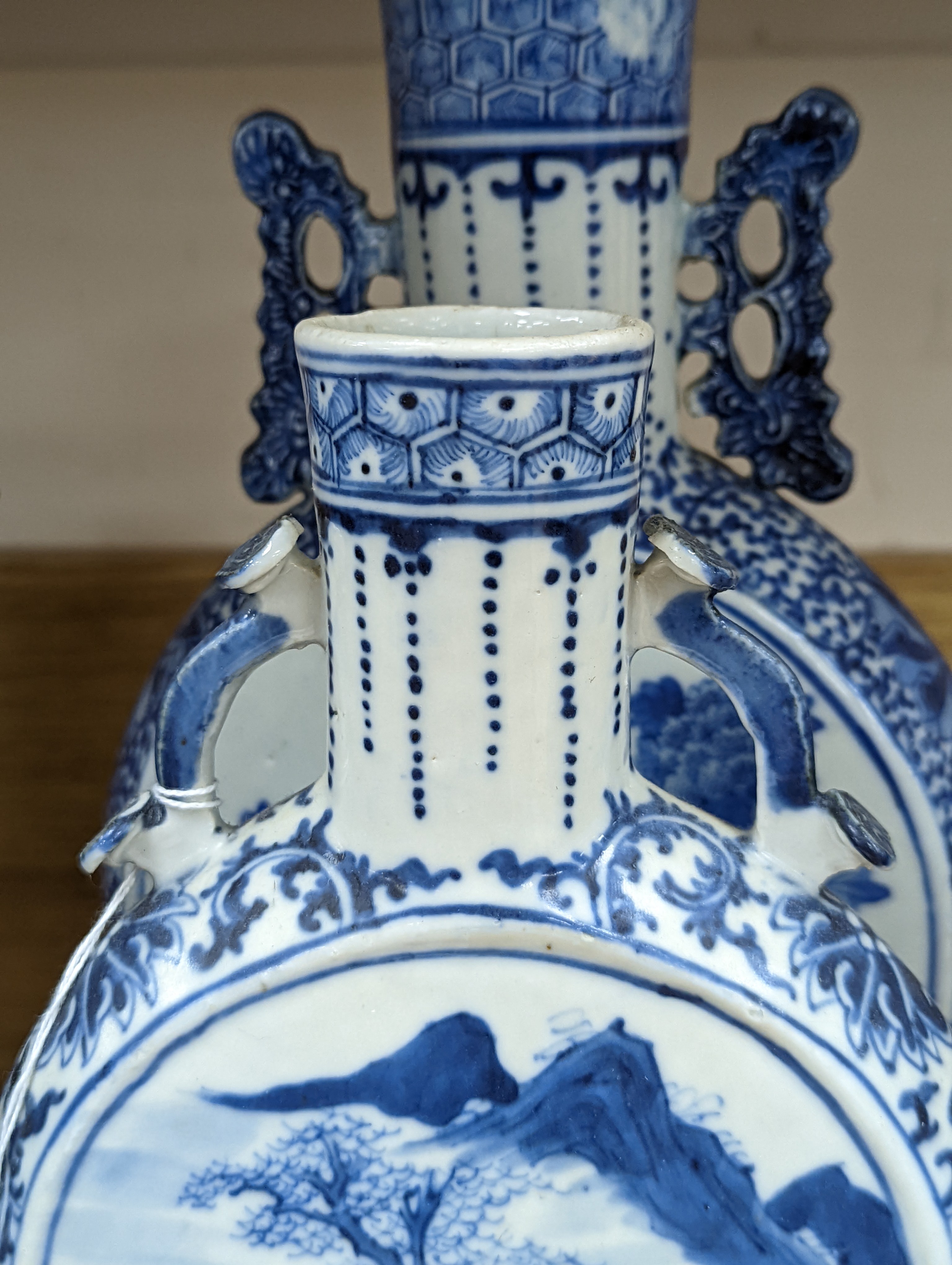 Three 19th century Chinese blue and white Moon flasks, tallest 31 cms.